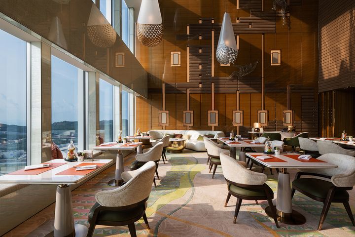 Luxury lounge at MGM COTAI offering stylish interiors, scenic views and sophisticated spaces for relaxation and wellness-focused stays.