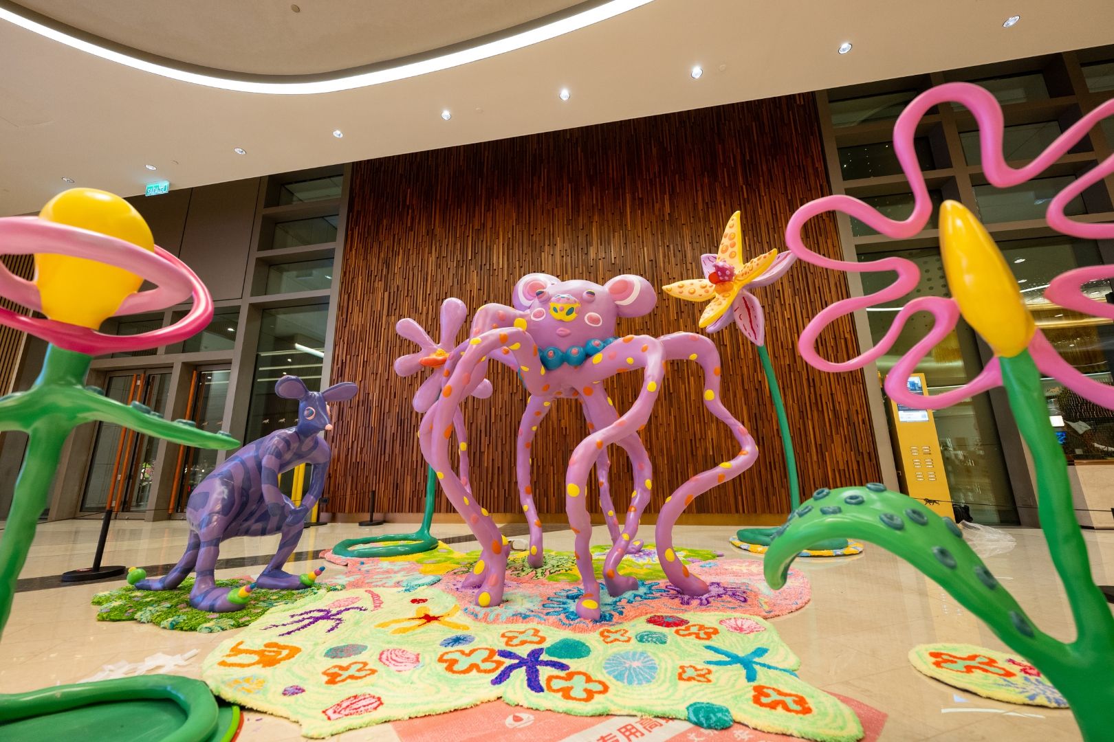 “Echo the Wind Wanderer” art installation at the Lion Lobby of MGM COTAI, featuring whimsical fantasy creatures and oversized floral sculptures as part of the Macau International Children’s Arts Festival.