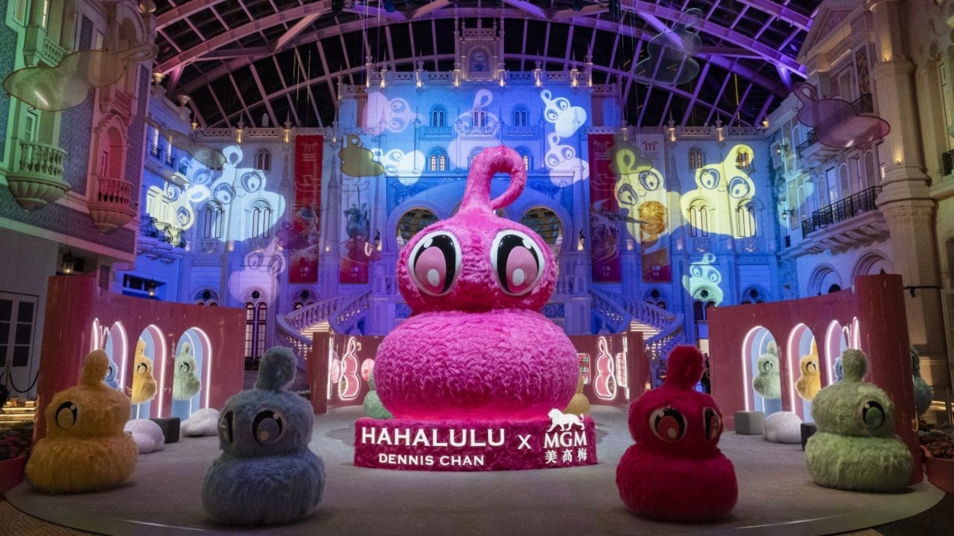HAHALULU art installation at Grande Praça in MGM MACAU, featuring the iconic hulu-inspired character surrounded by immersive projections, pop art elements and playful sculptural displays.