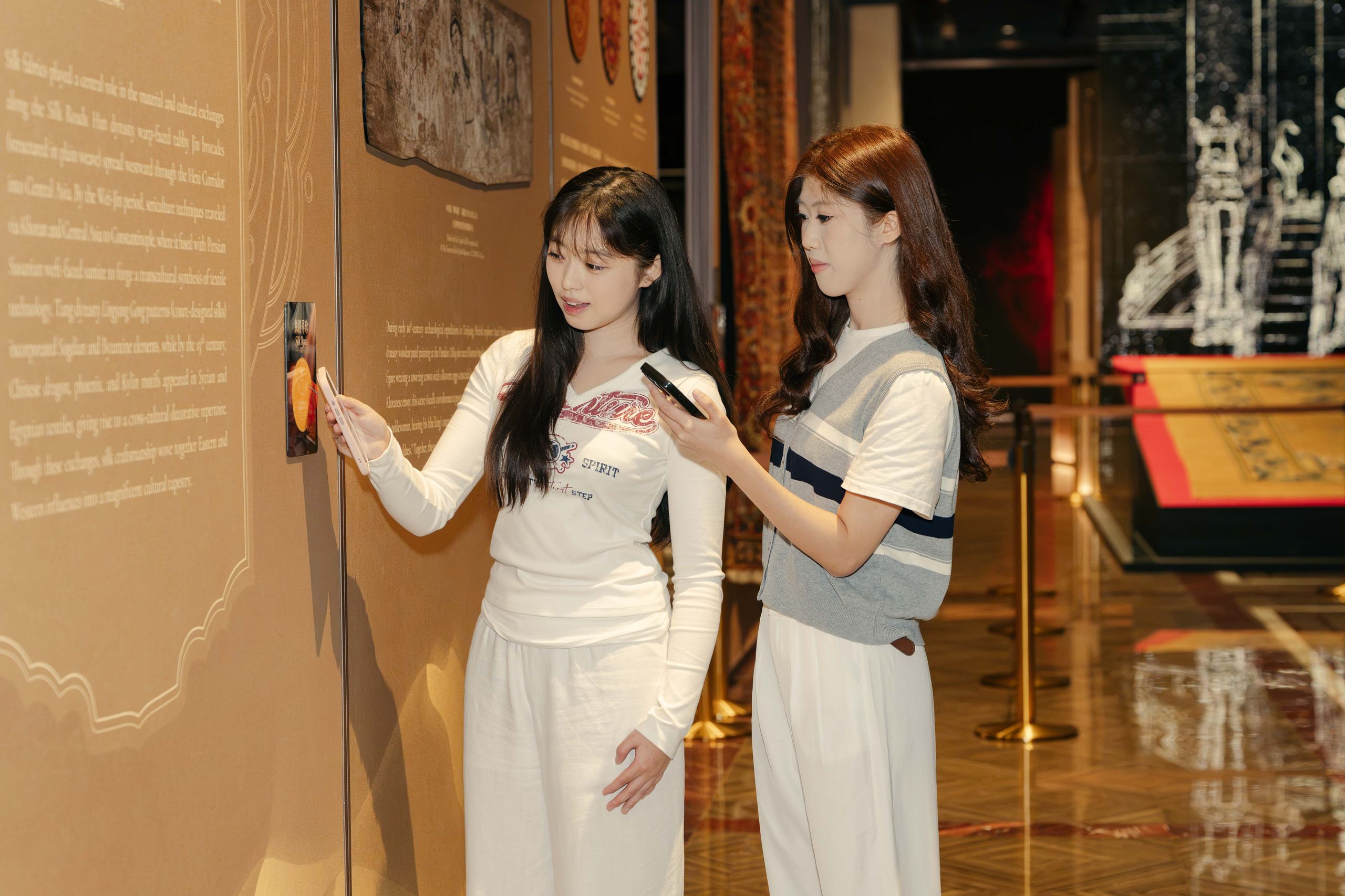 Visitors play the “Silk Road Go” digital card game at POLY MGM MUSEUM, using interactive technology to explore Silk Road history and cultural stories through a gamified museum experience.